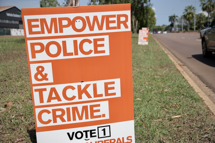 an orange sign saying 'empower police and tackle crime'