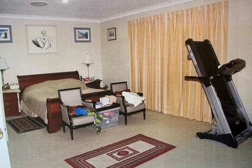 The inside of Novy Chardon's bedroom, with two chairs and a treadmill.
