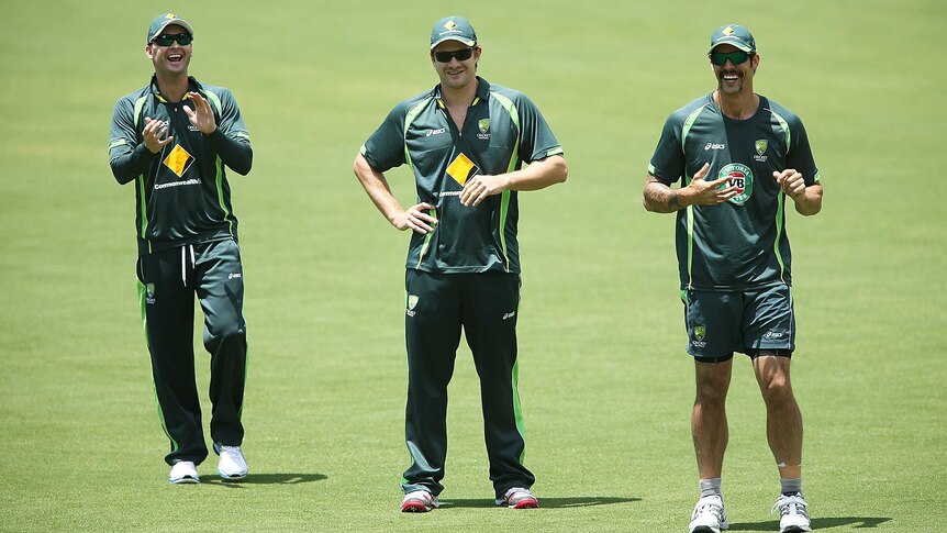 Michael Clarke, Shane Watson and Mitchell Johnson look on during a nets session at Adelaide Oval
