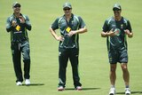 Michael Clarke, Shane Watson and Mitchell Johnson look on during a nets session at Adelaide Oval