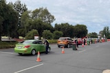 A line of cars at a border checkpoint in Victoria