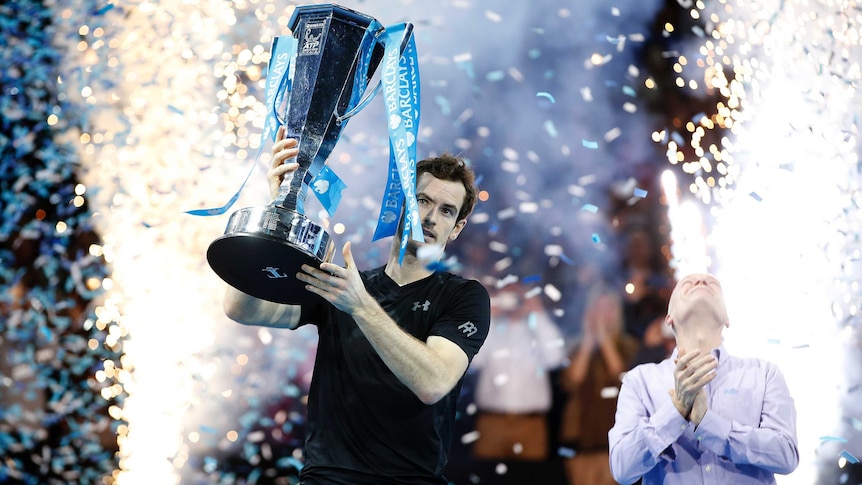 Andy Murray holds ATP World Tour Finals trophy aloft