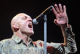 Garrett performs with Midnight Oil at Sound Relief