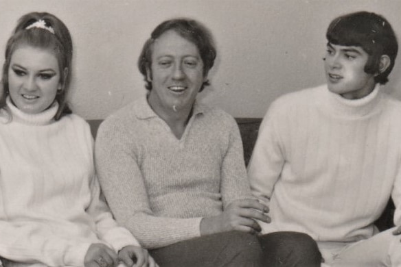 Old photo of Shirley Read left, her brother John Read on the right and music promoter Robert Stigwood sitting on a sofa