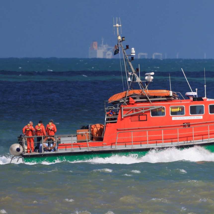 A rescue boat with a crew on board travels in the English Channel