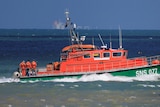A rescue boat with a crew on board travels in the English Channel