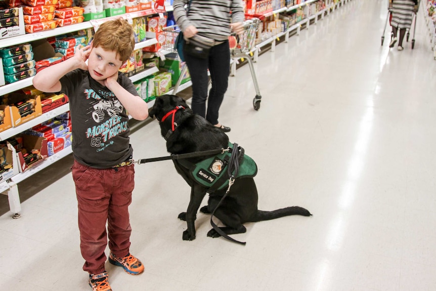 Reilly tethered to Jason in the supermarket.