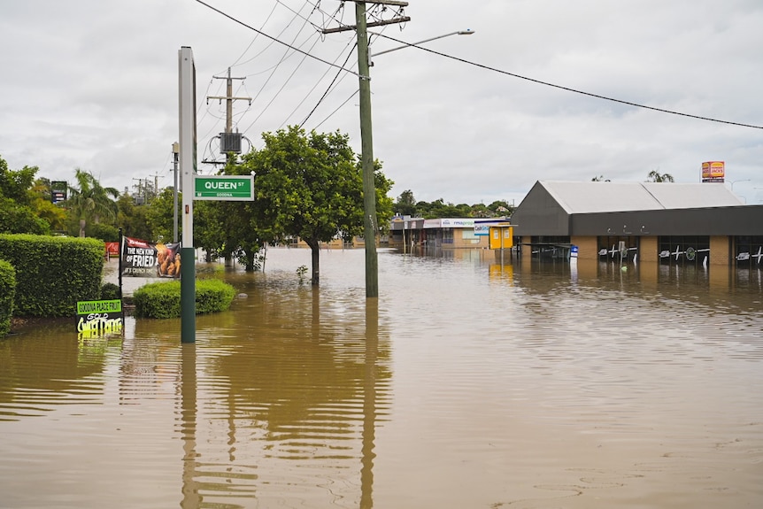 Flooded buildings in a street in Goodna.