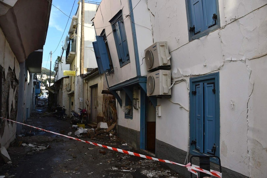 Damaged building are seen after an earthquake at the port of Vathi.