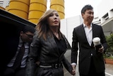 City Harvest Church founder Kong Hee (R) and his wife Sun Ho arrive at the State Courts in Singapore