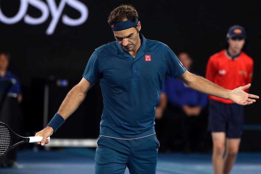 Roger Federer shrugs after losing a point at the Australian Open.