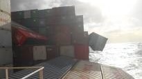 A screen grab from an onboard camera shows shipping containers tumbling from YM Efficiency.