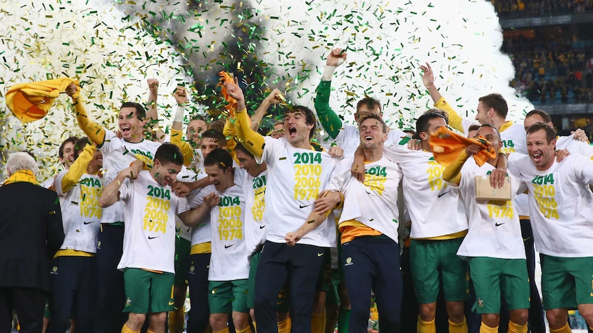 Socceroos celebrate on podium