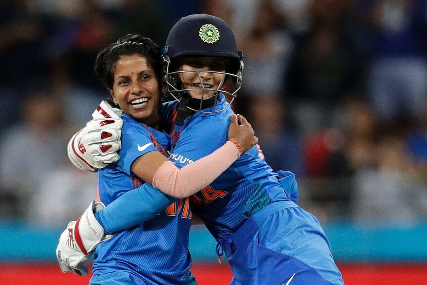 India bowler Poonam Yadav (left) and wicketkeeper Taniya Bhatia hug after a wicket in the T20 World Cup match against Australia.