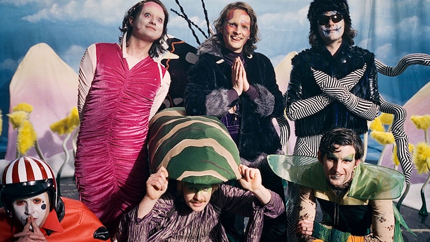 A on-set photo  from King Gizzard & The Lizard Wizard's 2021 music video 'Catching Smoke'