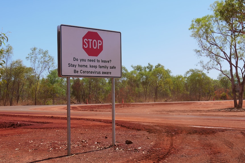 A roadsign in the desert asking people to stop and consider if their travel is essential during the pandemic.