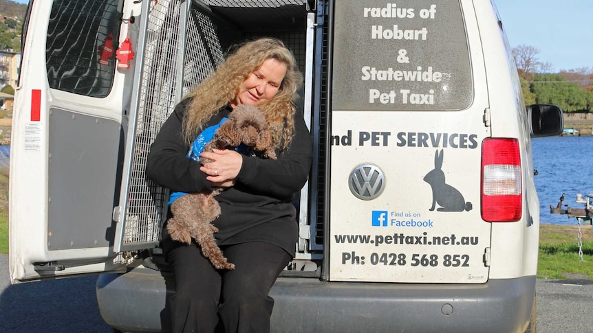 Pet Taxi owner, Kimberley with her dog.