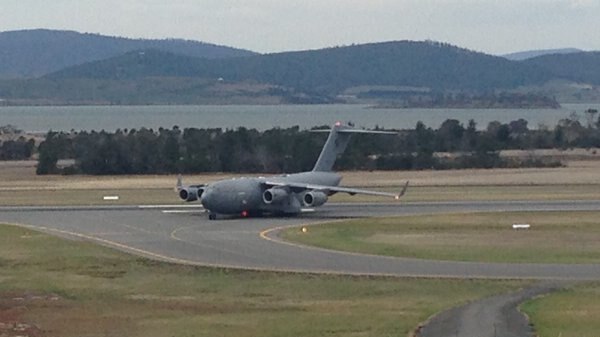 C-17 plane taxis on Hobart landing strip.