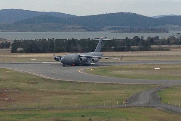 C-17 plane taxis on Hobart landing strip.