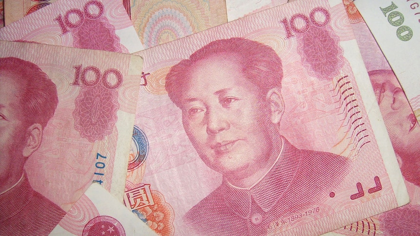 Red 100 yuan note of China's Renminbi currency with the late Chairman Mao's face.