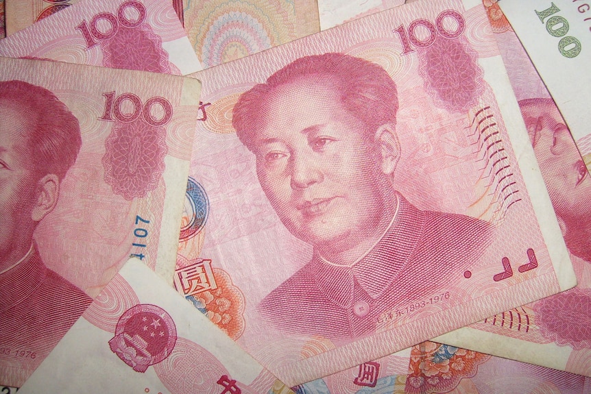 Red 100 yuan note of China's Renminbi currency with the late Chairman Mao's face.