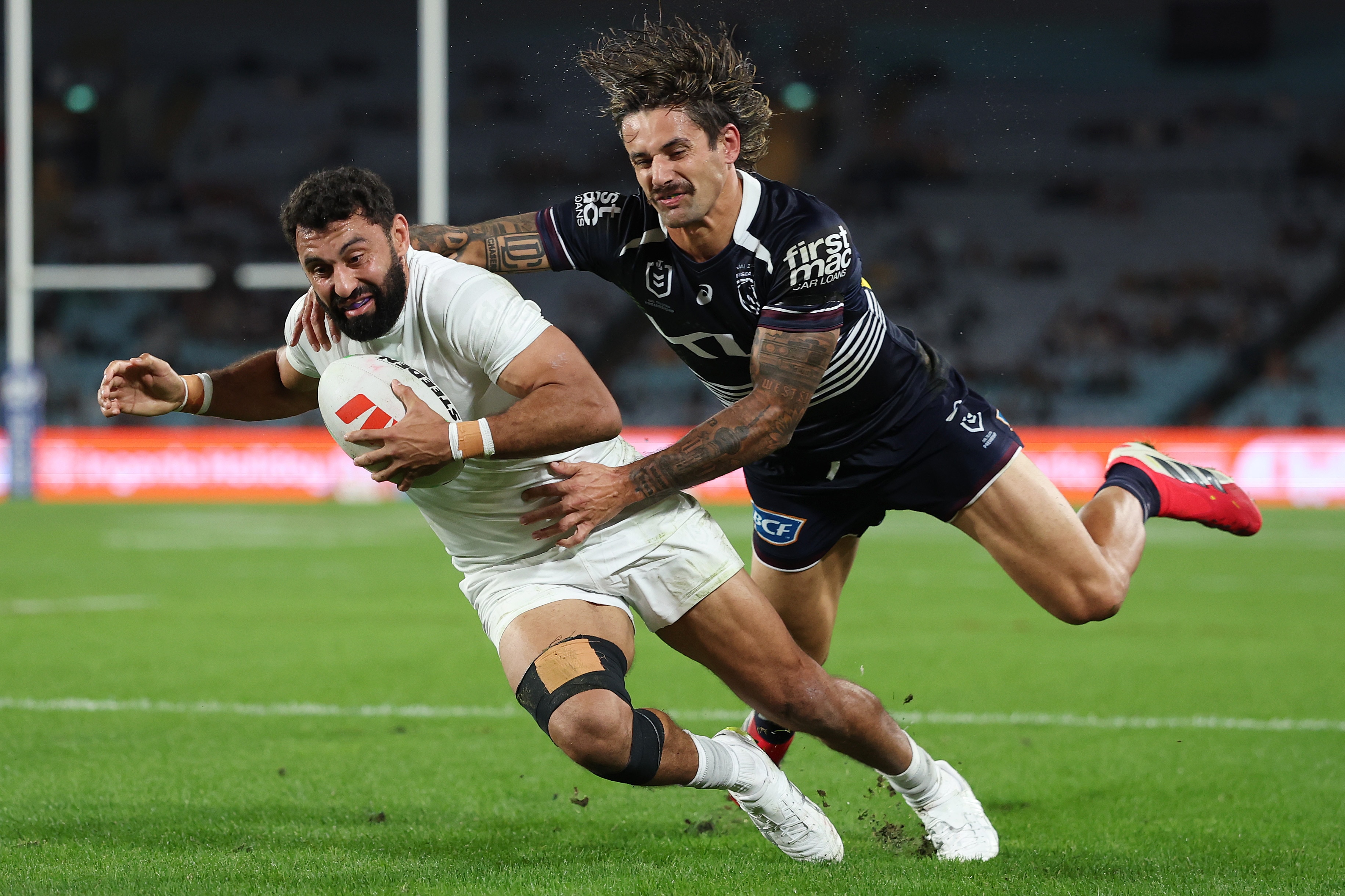Alex Johnston of the Rabbitohs scores a try