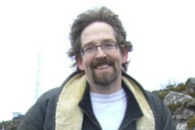 A photo of Stewart Williams, who was a senior lecturer at theUniversity of Tasmania, with the wind blowing in his hair.