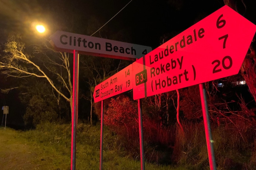 Street signs pointed towards Clifton Beach, Lauderdale, Rokeby and Hobart