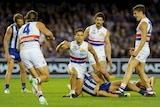 Luke Dahlhaus celebrates as the Bulldogs beat North Melbourne