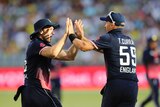 England's Tom Curran (R) and David Willey celebrate the dismissal of Australia's Marcus Stoinis.