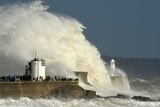 Waves crash over the lighthouse as storm Ophelia passes Porthcawl, Wales, Britain, October 16, 2017.