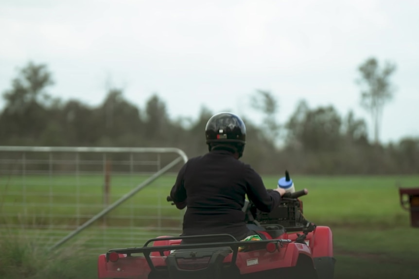 Image of a woman riding a quad bike. 