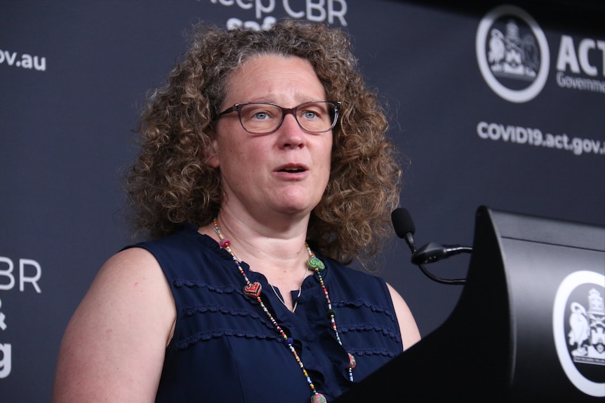 Kerryn Coleman speaks at a press conference. She looks serious.