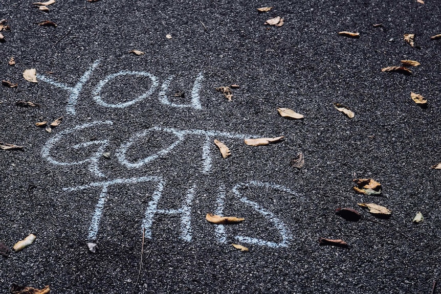 'You got this' written in chalk on a road representing the motivation required to change careers later in life.