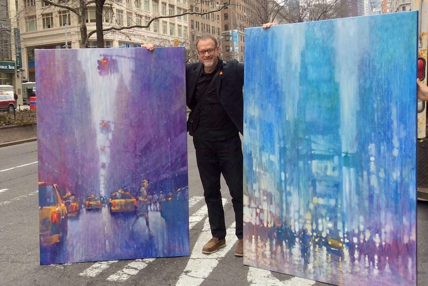 David Hinchliffe with paintings
