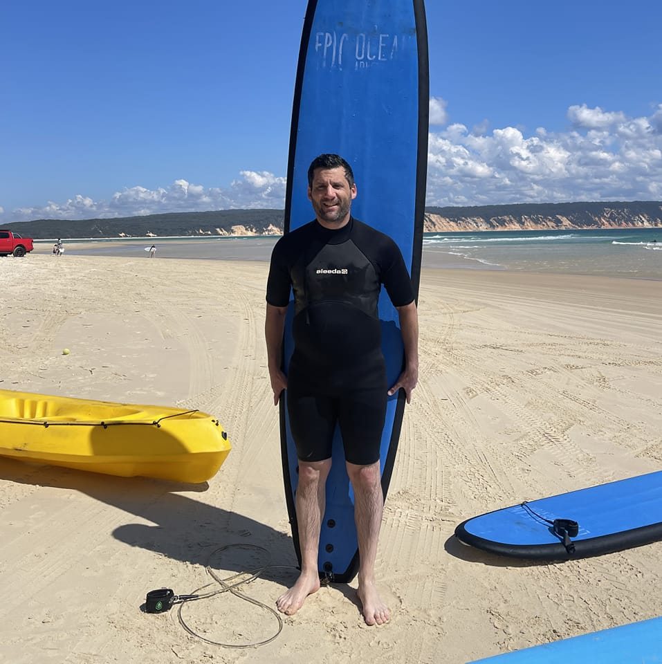 A bearded man takes a selfie.
