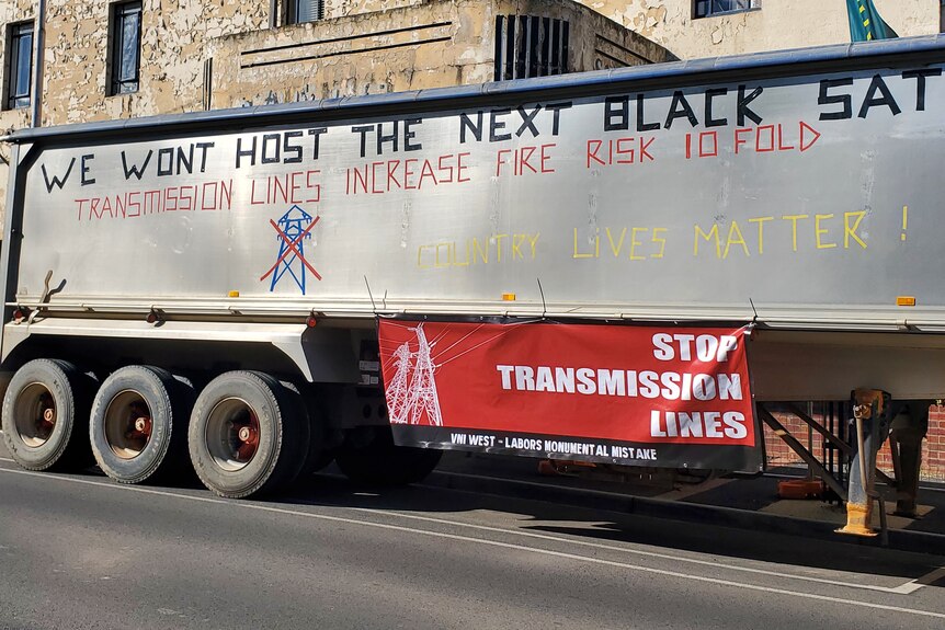a truck with 'country lives matter' and 'we won't host the next black sat' written in protest