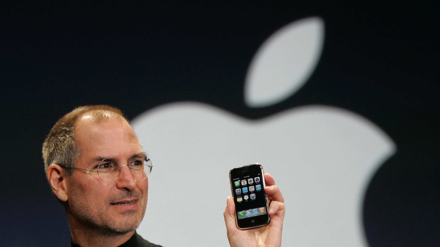 Apple CEO Steve Jobs holds up the new iPhone in 2007