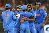 Easy win ... India's Umesh Yadav is congratulated by team-mates after taking the wicket of Mushfiqur Rahim