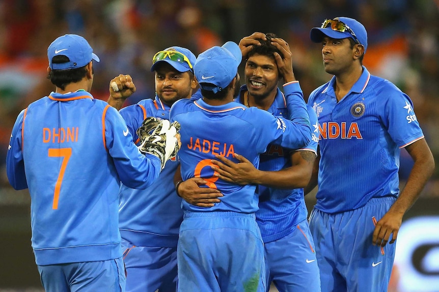 Yadav celebrates a wicket with India team-mates