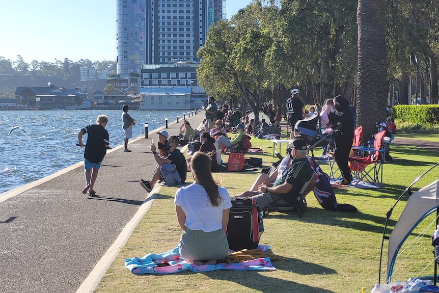People sitting on the grass on the Perth foreshore