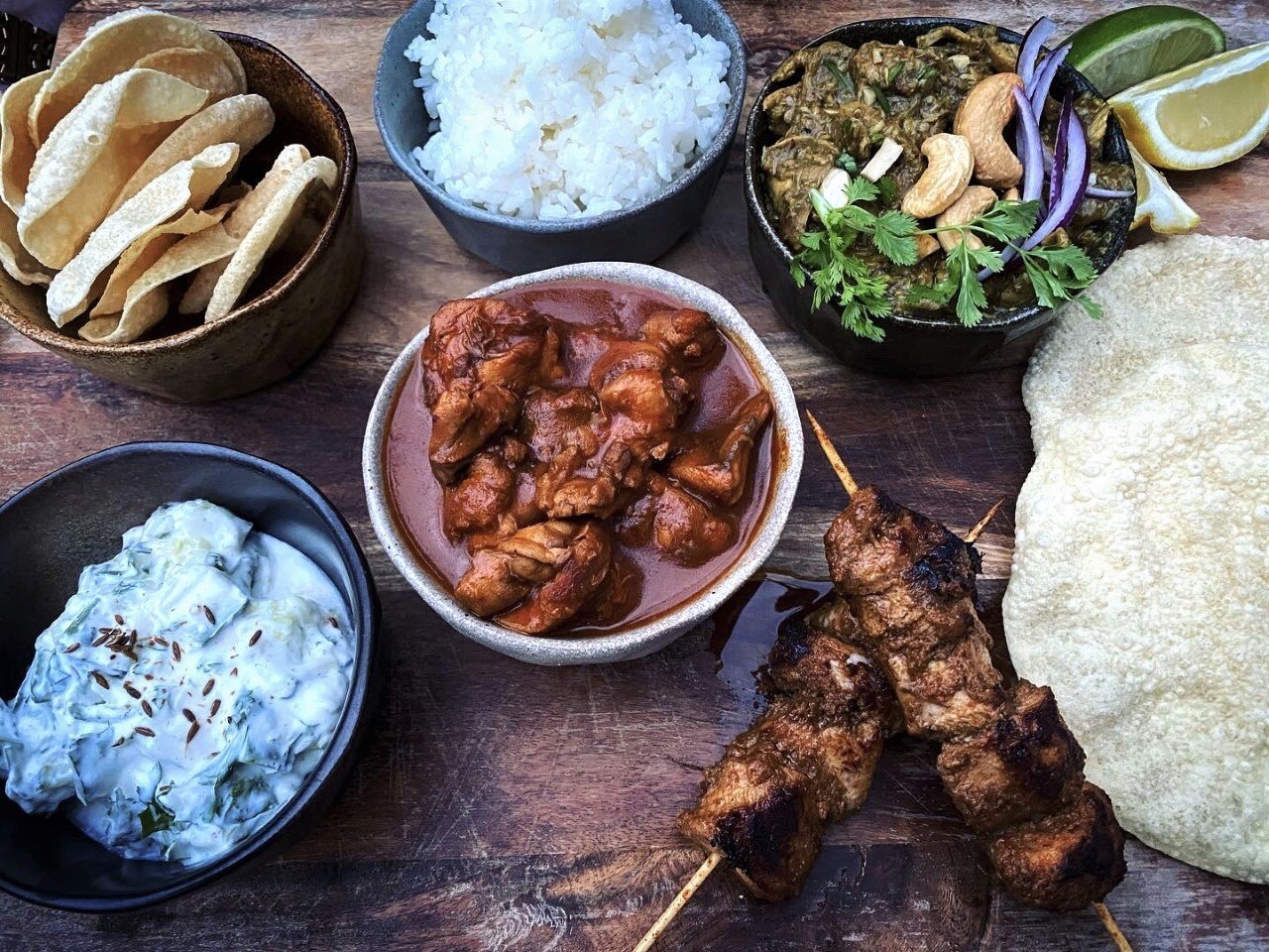 Bowls of colourful food on a table.
