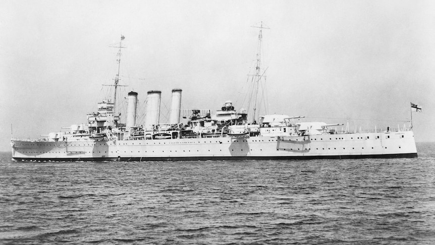 Black and white image of a large heavy cruiser in the ocean