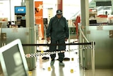 A police officer walks through the scene at Sydney airport where a man was killed March 2009.