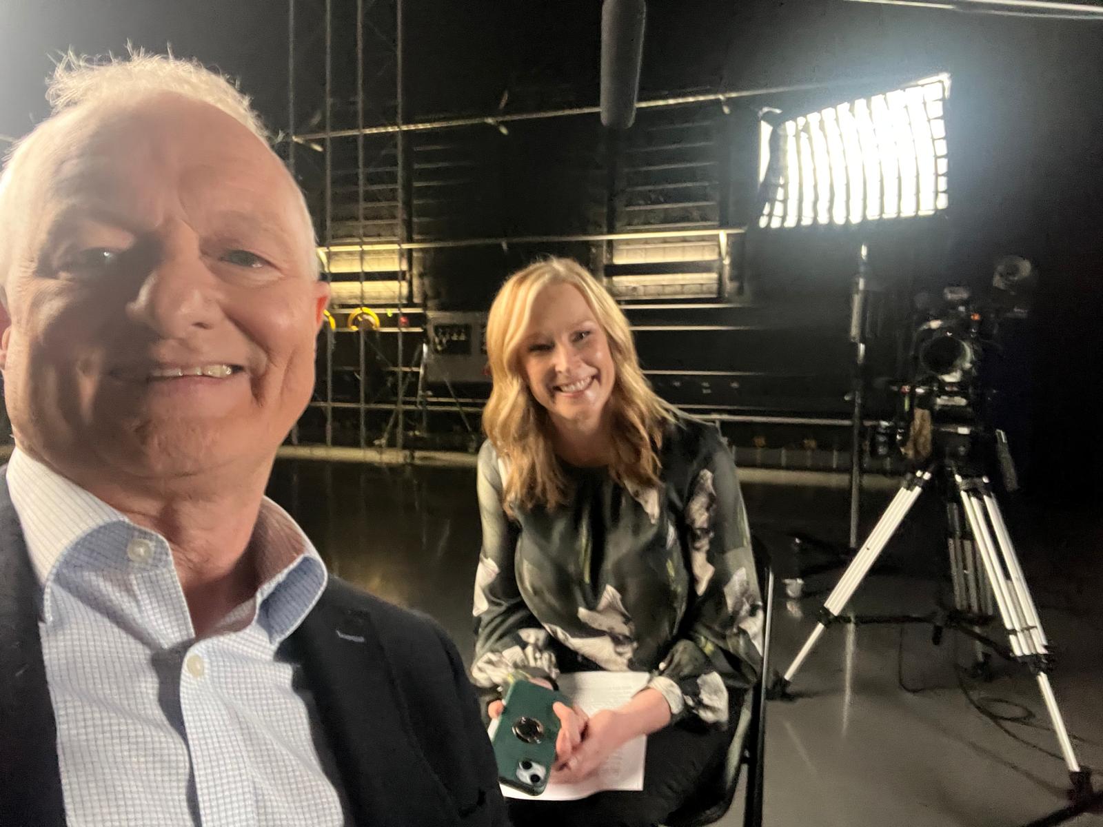 Antony Green taking a selfie in studio spaces with Leigh Sales