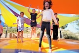 Kids play on jumping pillow