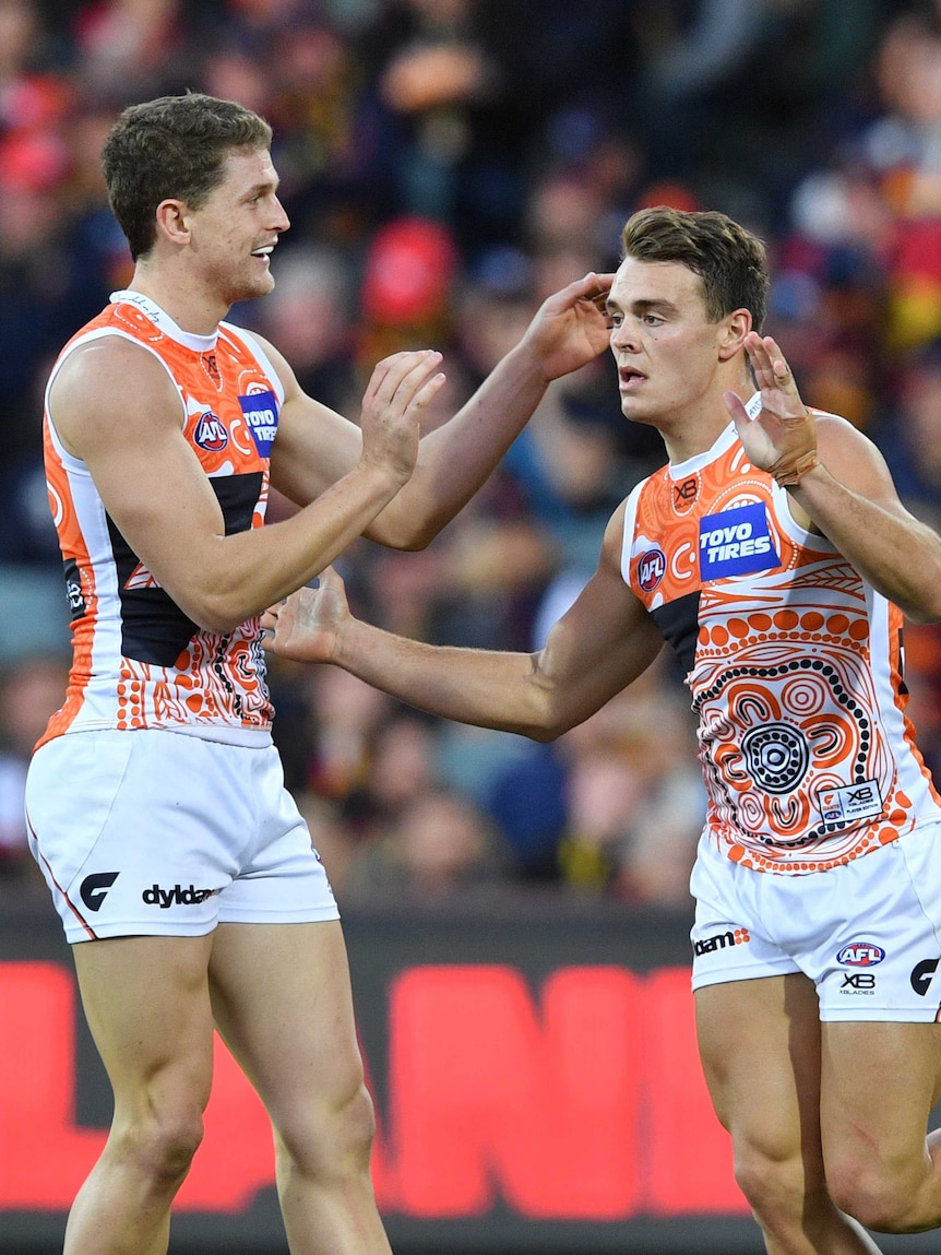 Zac Langdon celebrates goal for Giants against Crows