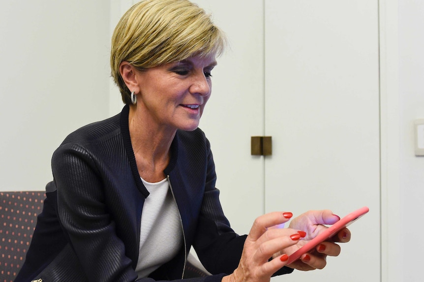 Julie Bishop with her smartphone