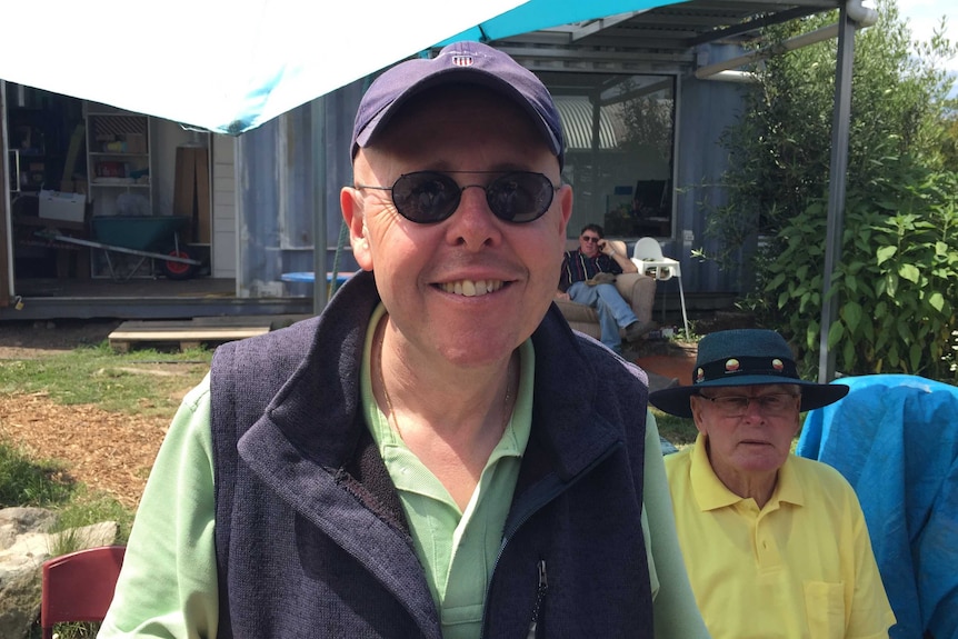 Anatoli Stirkul smiles in the community garden