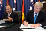 Kevin Rudd and Peter O'Neill sign a Regional Resettlement Agreement